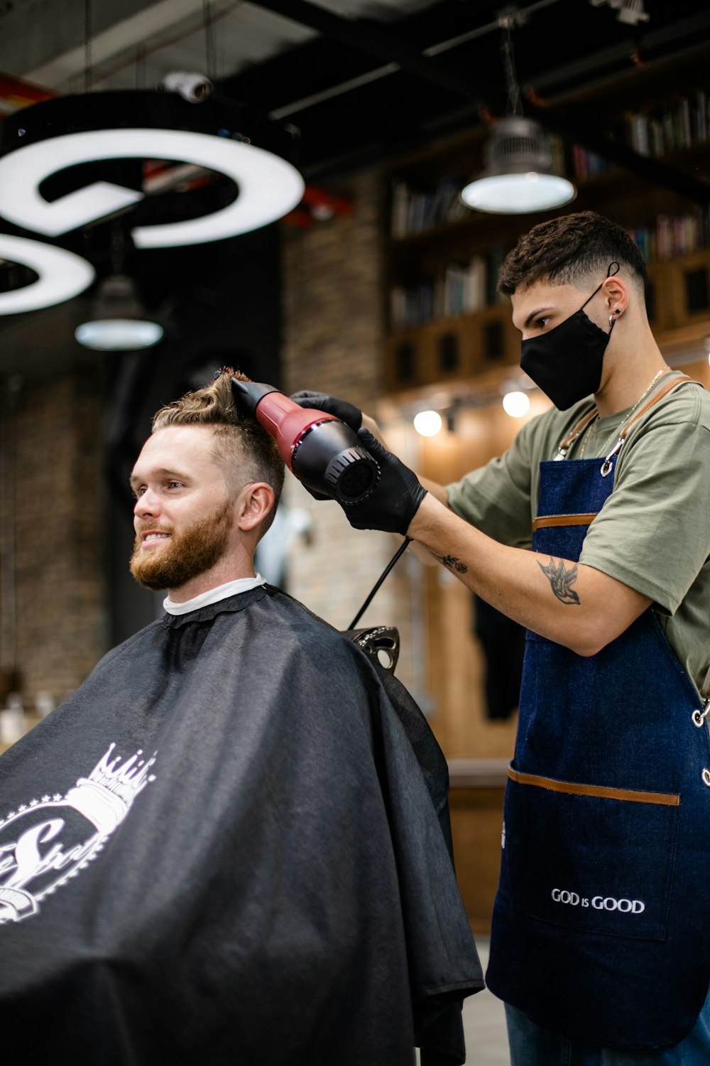 Hair stylist working with a client
